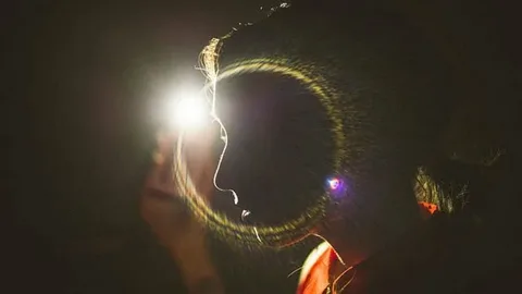 Soft photeeq lens flare adding romance to a wedding photo